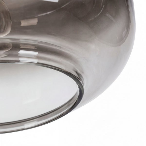 Nahaufnahme eines runden Lampenschirms aus Rauchglas.