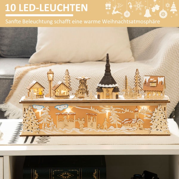 Weihnachtsdekoration aus Holz mit 10 LED-Leuchten, ein hell beleuchtetes Winterdorf mit Kirche auf einem Tisch in einem gemütlichen Raum.