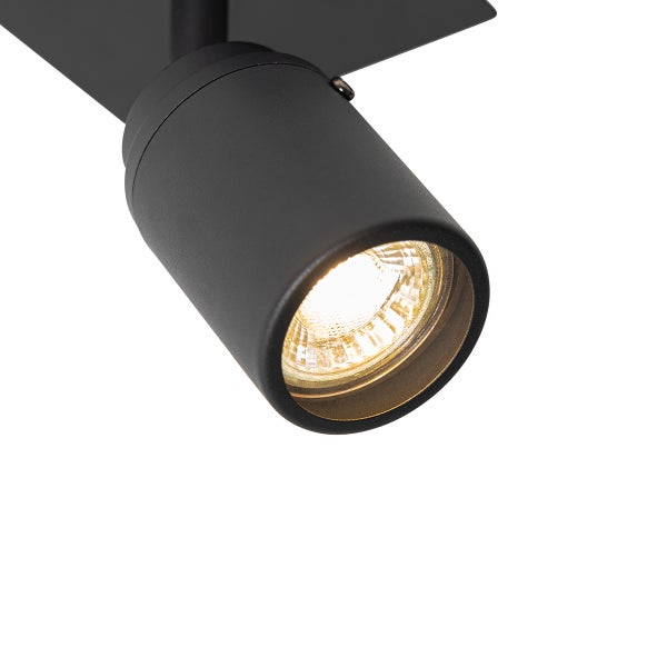 Schwarzer Deckenspot mit eingeschaltetem Leuchtmittel