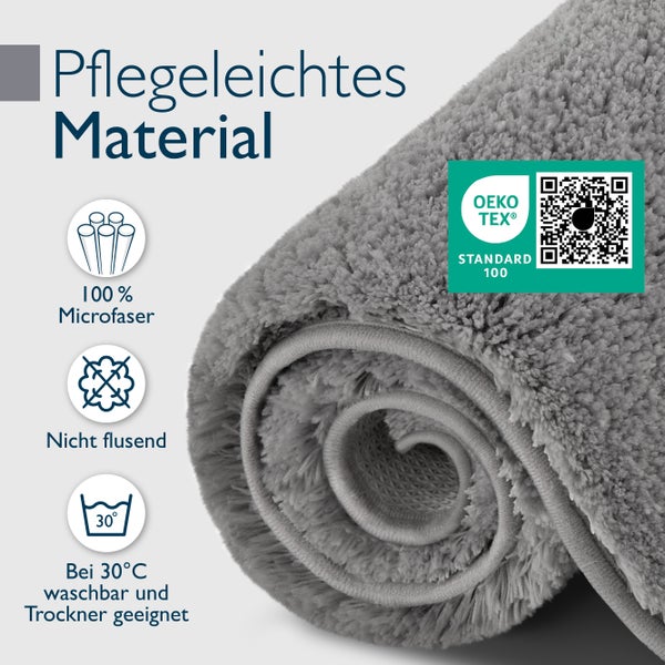 Aufgerollter Badteppich aus pflegeleichter Mikrofaser mit Oeko Tex Standard 100 Zertifizierung, nicht flusend und bei 30 Grad waschbar.