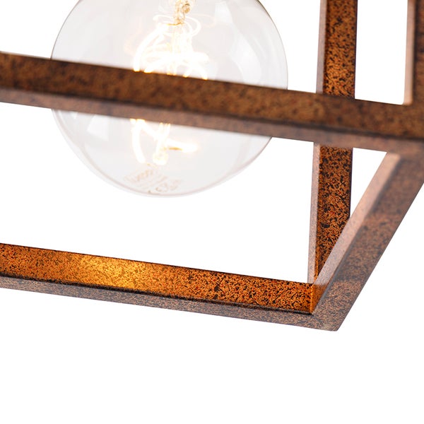 Detailansicht einer Pendelleuchte mit einem geometrischen Lampenschirm und einer Glühbirne.