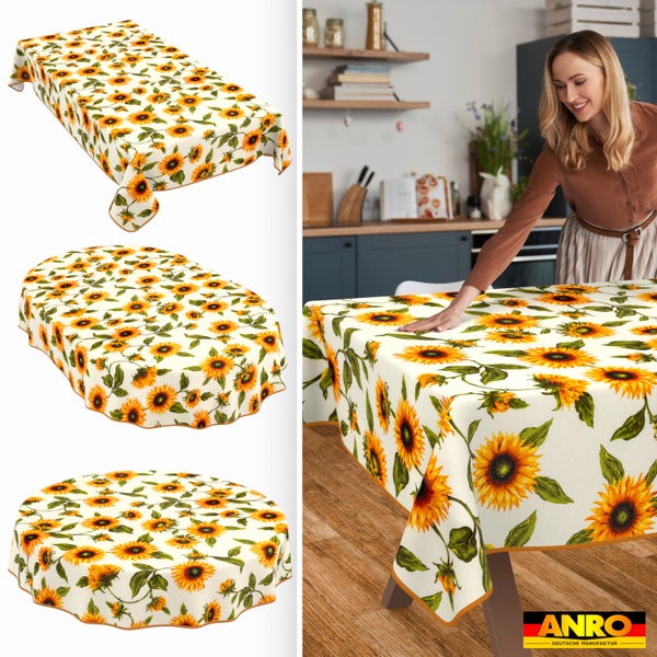 Tischdecke mit Sonnenblumenmuster in eckig, oval und rund sowie eine Frau, die das Tischtuch in einer hellen, aufgeräumten Küche glattstreicht. ANRO Logo.