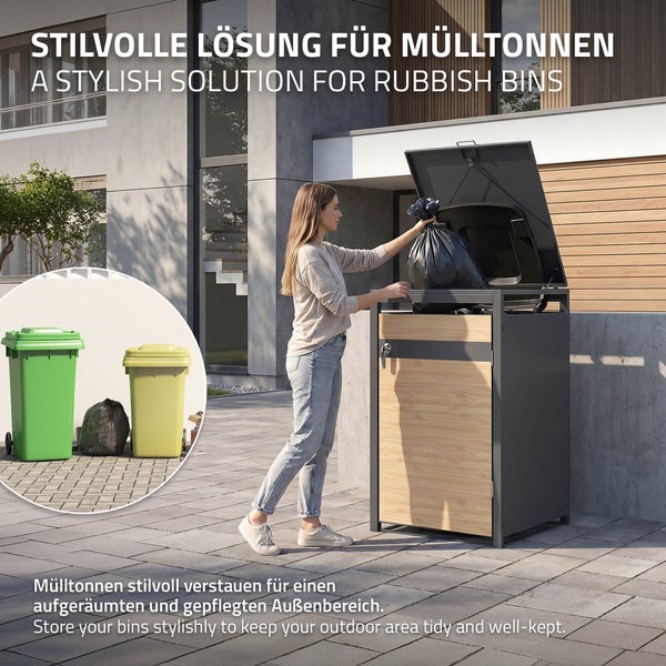Moderne Mülltonnenbox aus Metall und Holz für einen gepflegten Außenbereich, Frau wirft Müllsack in die geöffnete Mülltonnenverkleidung.