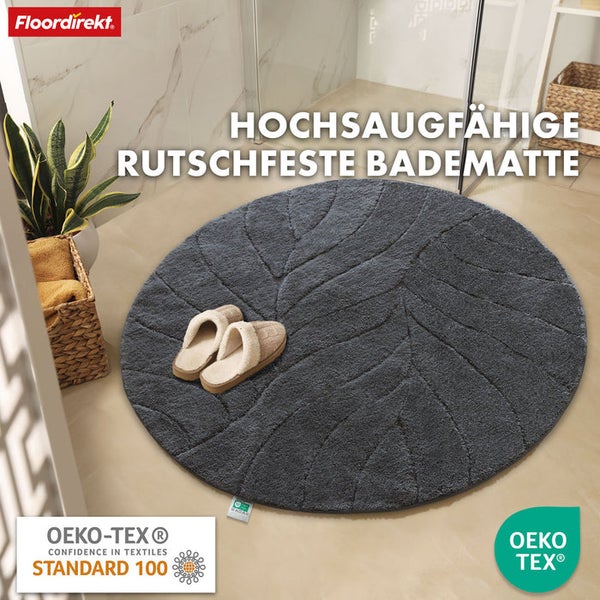 Runde, rutschfeste Badematte mit Blattmuster im Badezimmer