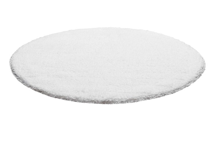 Nahaufnahme eines weißen Teppichs mit Fransen