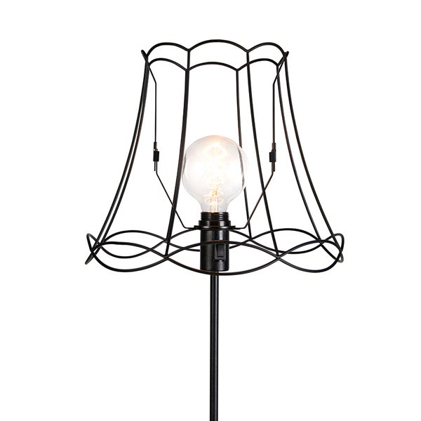 Stehlampe mit schwarzem Metallgestell und dekorativer Glühbirne