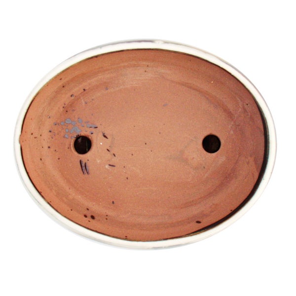 Ovale Bonsaischale aus Terracotta mit zwei Drainagelöchern in der Draufsicht.