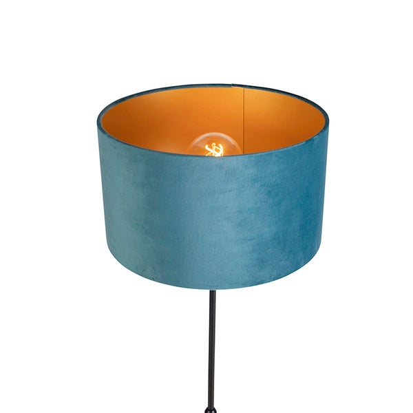Stehlampe mit blauem Schirm und goldfarbener Innenseite