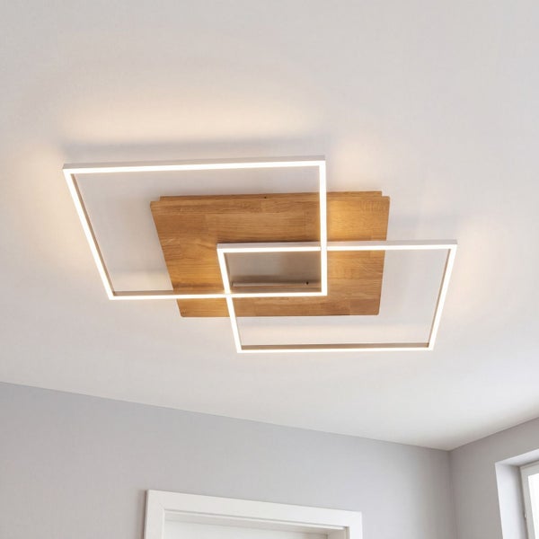 Moderne quadratische LED Deckenleuchte aus Holz mit zwei geometrischen Lichtrahmen für eine gleichmäßige Raumbeleuchtung.