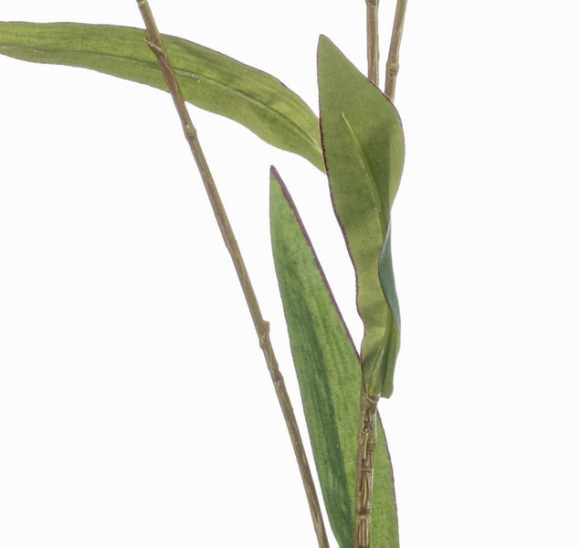 Künstliche Lilie mit gepunkteten rosa Blütenblättern und grünen Blättern.