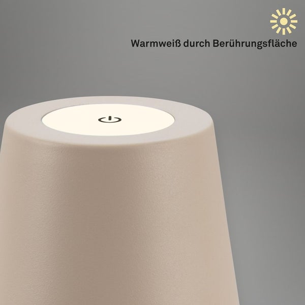 Nahaufnahme der Oberseite einer Lampe mit beleuchteter Berührungsfläche und Ein-Aus-Symbol für warmweißes Licht.