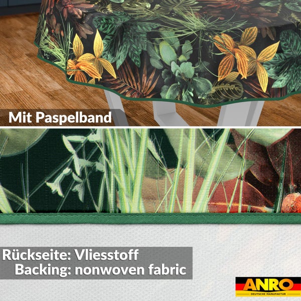 Runde Tischdecke mit tropischem Pflanzenmuster, grünem Paspelband und Rückseite aus Vliesstoff. ANRO Logo.