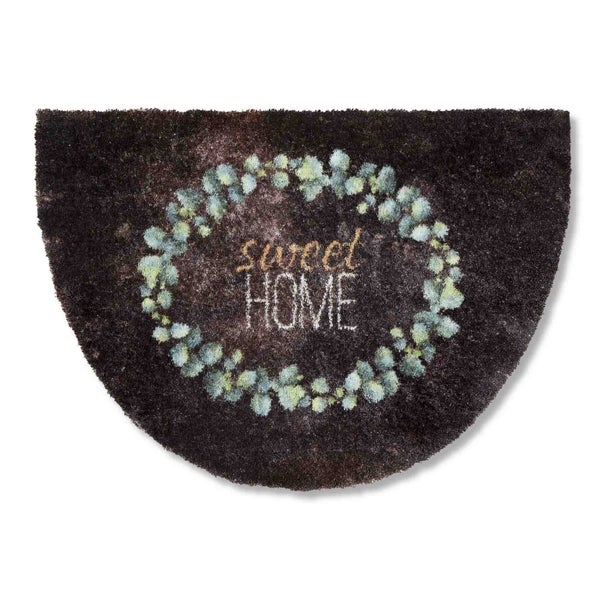 Fußmatte mit der Aufschrift Sweet Home und einem Kranz aus Blättern