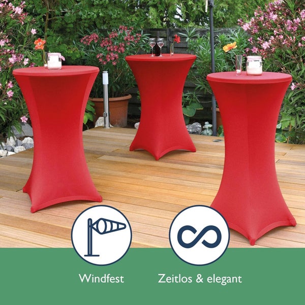 Drei rote Stehtische im Garten mit Pflanzen im Hintergrund. Windfest. Zeitlos und elegant.