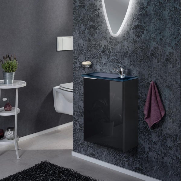 Modernes Badezimmer mit schwarzem Waschtisch, Aufsatzwaschbecken und beleuchtetem Spiegel
