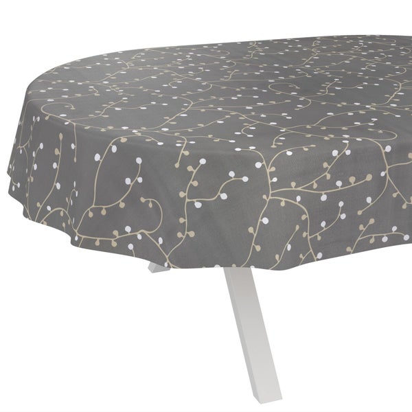 Graue ovale Tischdecke mit beigem Rankenmuster und weißen Punkten auf einem Tisch.