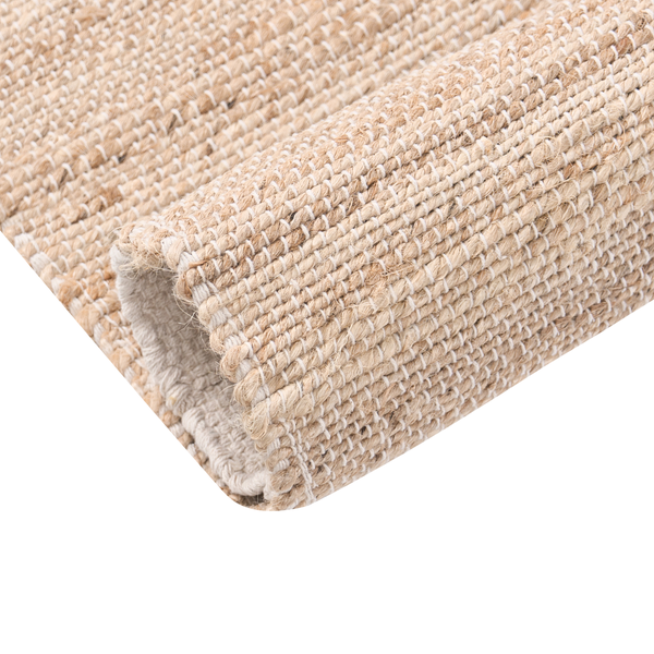 Nahaufnahme eines handgewebten Teppichs aus Jute und Baumwolle mit unterschiedlichen Strukturen.