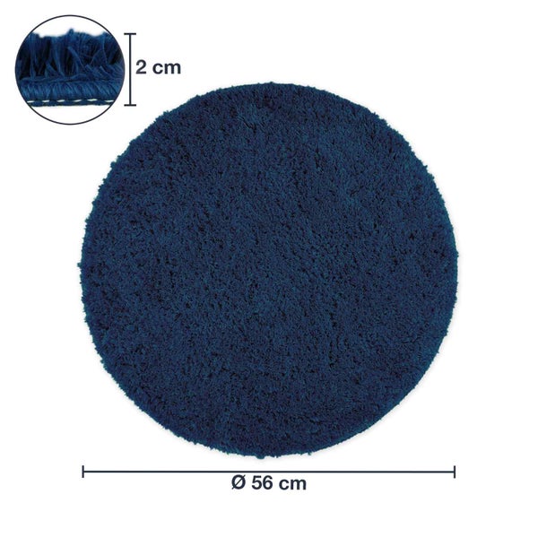 Runder Teppich mit einem Durchmesser von 56 cm und einer Florhöhe von 2 cm.