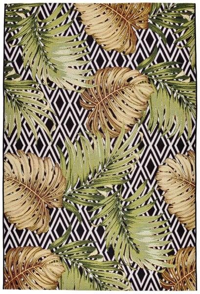 Teppich mit tropischem Muster, Monstera- und Palmenblättern auf geometrischem Hintergrund.