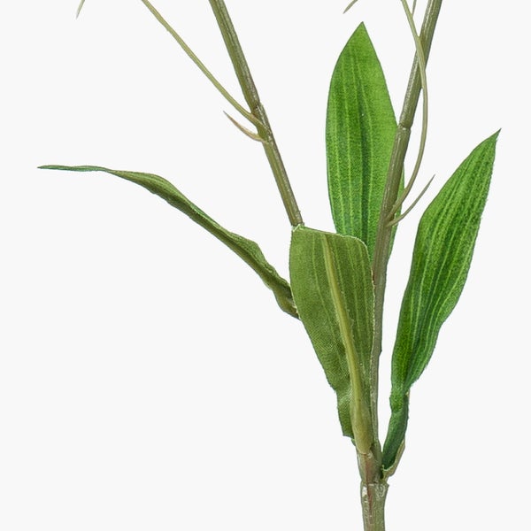 Künstlicher Blumenzweig mit weißen Blüten und grünen Blättern.