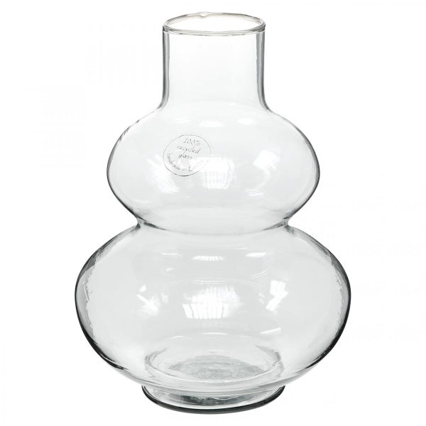 Glasvase aus Recyclingglas mit Tulpen in einem dekorativen Arrangement auf Holzkisten.