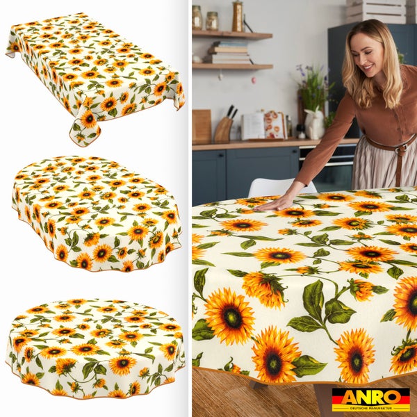 Tischdecke mit Sonnenblumenmuster in rechteckiger, ovaler und runder Form, abgebildet in einer hellen Küche. ANRO Logo.