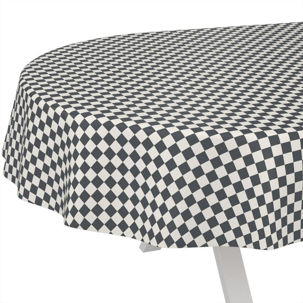 Runde Tischdecke mit Karomuster auf einem Tisch.