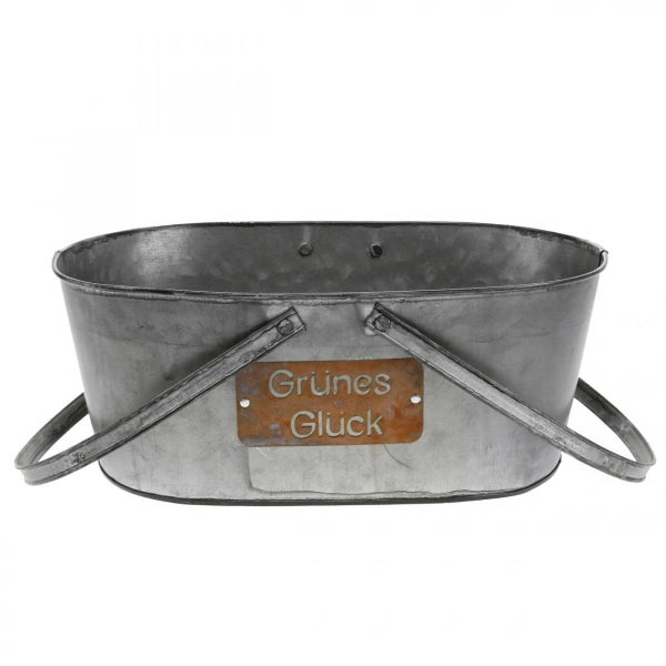 Ovale Zinkwanne mit der Aufschrift Grünes Glück und Griffen