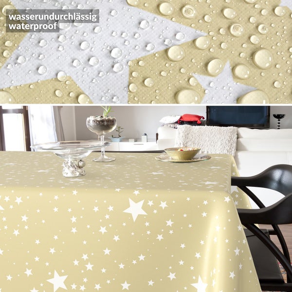 Wasserundurchlässige Tischdecke mit Sternenmuster im Wohnzimmer, Detailansicht von Wassertropfen auf der Oberfläche.