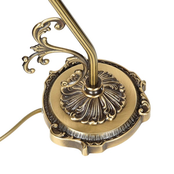 Detailaufnahme des verzierten Lampenfußes im Vintage-Stil.