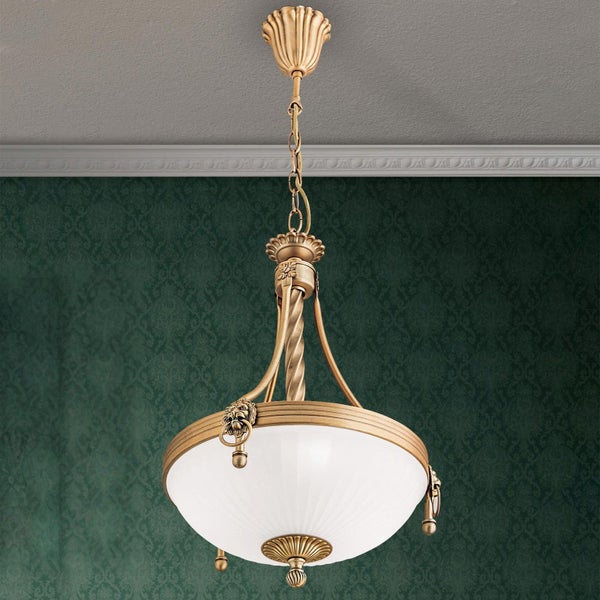 Klassische Pendelleuchte im Antikstil mit Schirm aus Glas und verzierten Metalllementen in Löwenkopfoptik für die Deckenmontage