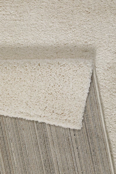 Hochflor-Teppich Shaggy mit weicher Oberfläche und gewebter Rückseite.
