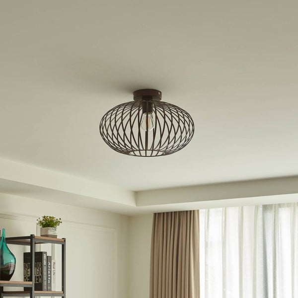 Deckenleuchte mit Metallgestell und Glühbirne im Wohnzimmer