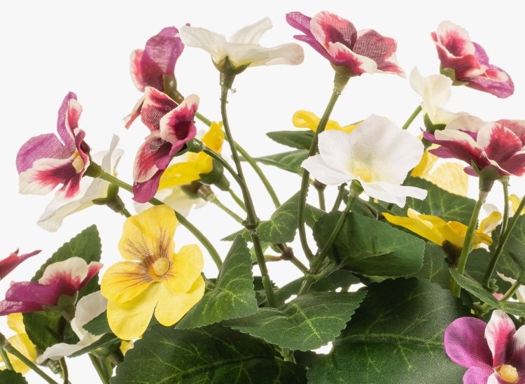 Künstlicher Magnolienzweig mit weißen Blüten und gelber Mitte an braunen Ästen.