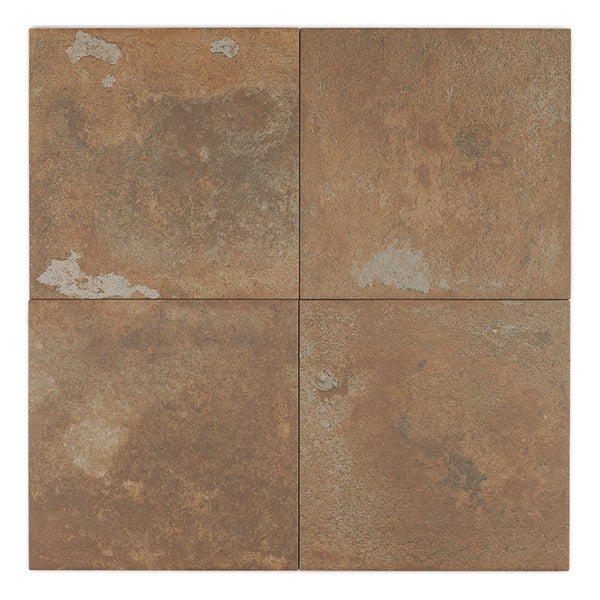 Vier quadratische Fliesen mit rustikaler Oberfläche in Betonoptik für Wand und Boden