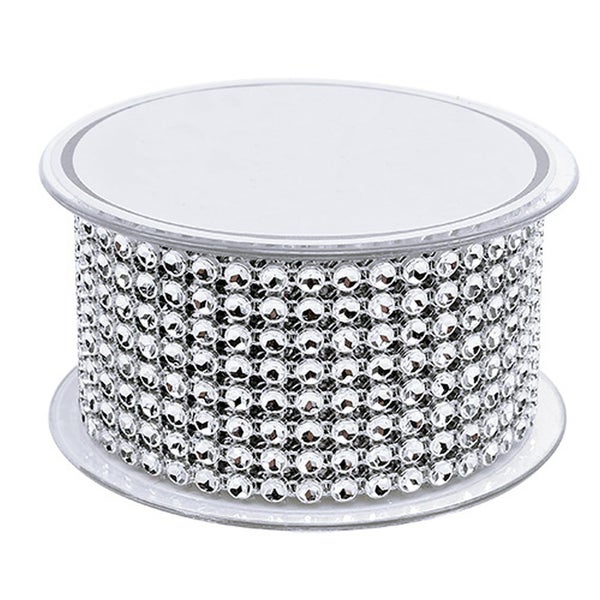 Dekoband mit kleinen, runden Ziersteinen auf einer Spule