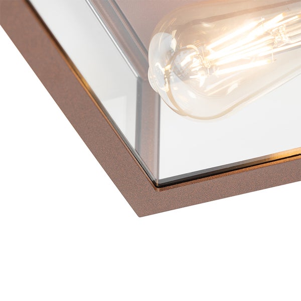 Nahaufnahme einer Leuchte mit Metallrahmen, Glaseinsätzen und einer leuchtenden Filament-Lampe.