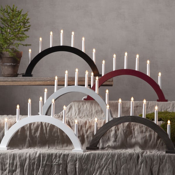 Grauer Schwibbogen mit sieben Kerzen
