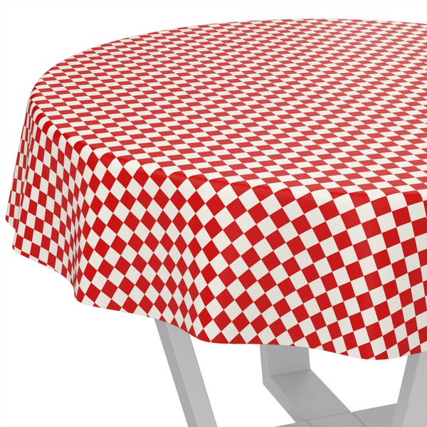 Runde Tischdecke mit rot-weißem Karomuster.