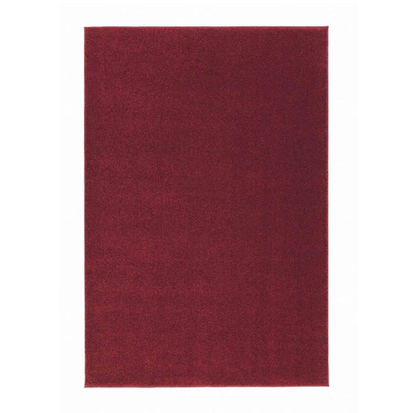 Rechteckiger roter Teppich in Unifarben mit kurzem Flor.