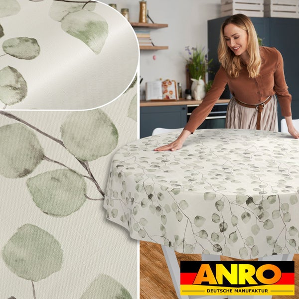 Runde, abwischbare Tischdecke mit Eukalyptus-Motiv in einer hellen, aufgeräumten Küche, Detailansicht der Textur und ANRO Logo.