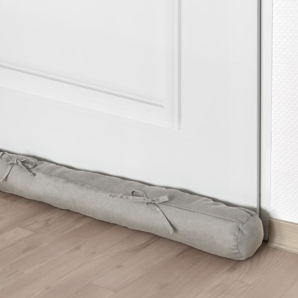 Zugluftstopper vor einer Tür auf dem Boden