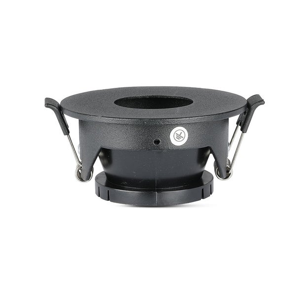 Schwarzer, runder Einbaustrahler aus Metall mit seitlichen Montagefedern und Erdungssymbol.