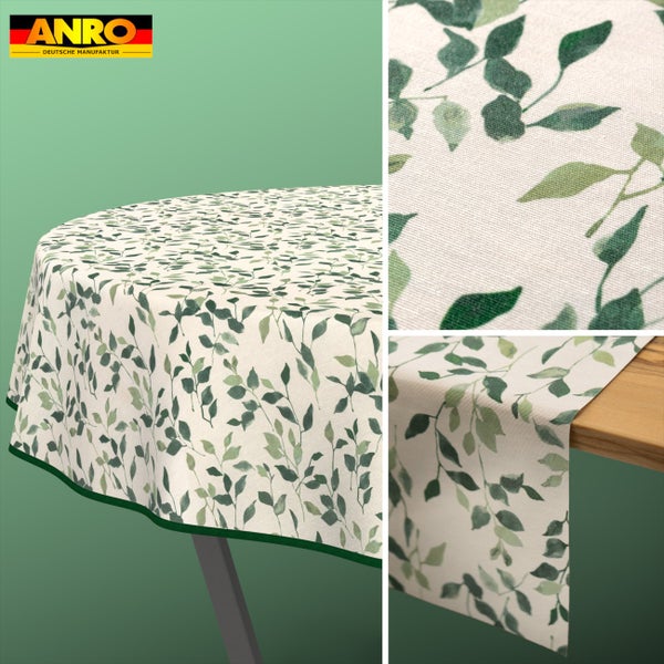 Anro Logo. Runde Tischdecke und Tischläufer mit Blattmuster. Nahaufnahme der gewebten Stoffstruktur und des Blattdesigns.