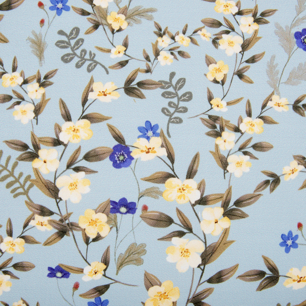 Stoff mit Blumenmuster und Blattwerk auf strukturiertem Untergrund