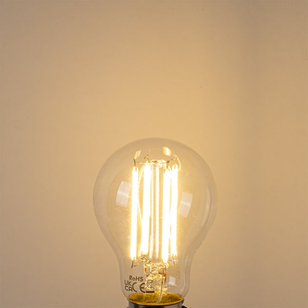 Leuchtende LED-Filament-Lampe in Birnenform aus klarem Glas.