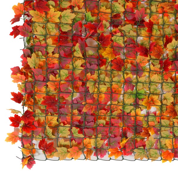 Dekorative Laubmatte mit Herbstlaub-Imitation und Gitterstruktur.