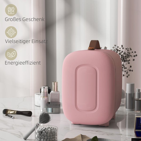 Rosa Kosmetikkühlschrank mit Tragegriff auf Marmortisch neben Make-up und Pflegeprodukten. Symbole für Geschenk, vielseitigen Einsatz und Effizienz.