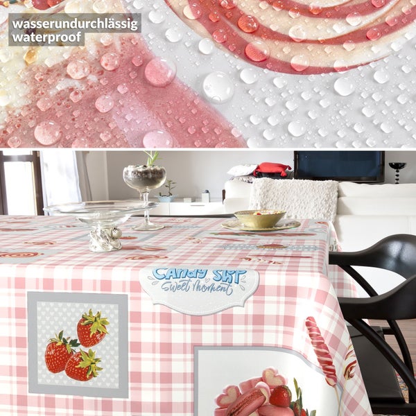 Wasserundurchlässige Tischdecke mit Erdbeeren- und Macaron-Motiven, Karomuster, in einem Wohnzimmer.