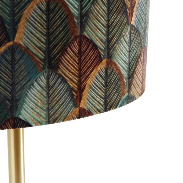 Detail einer Stehlampe mit Blattmuster und goldfarbenem Ständer